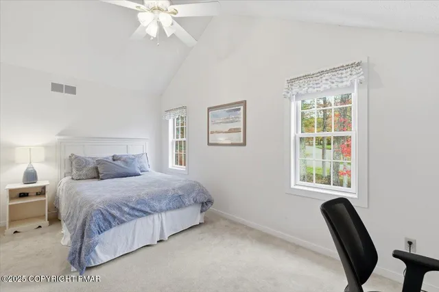 an aerial view of a house with a garden