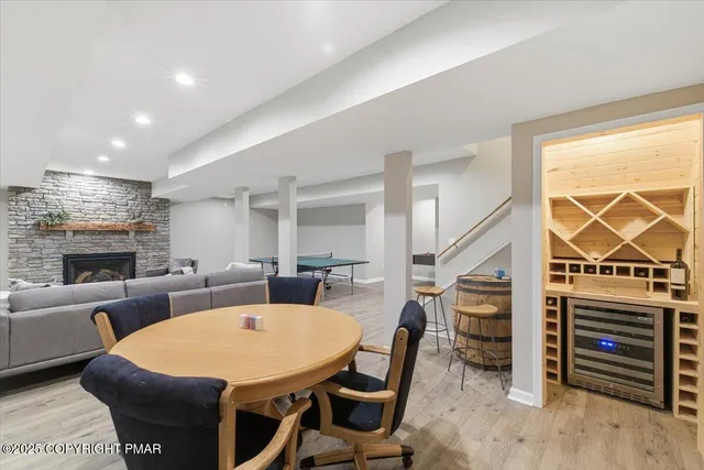 a kitchen with stainless steel appliances granite countertop a sink and cabinets with wooden floors