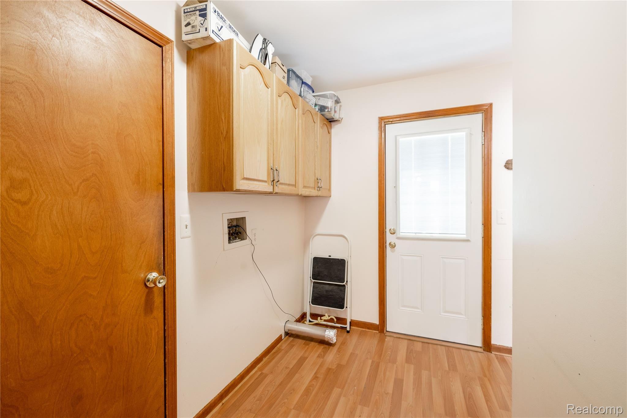 8653 Lake Road Grosse Ile, MI 48138 - Photo 13 of 34 8653 Lake Rd, Grosse Ile - Main Floor Laundry Room with Side Door Access