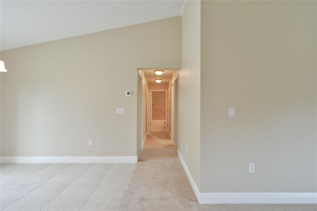 16219 Southwest 48th Circle Ocala, FL 34473 - Photo 24 of 36 a view of a hallway with wooden floor