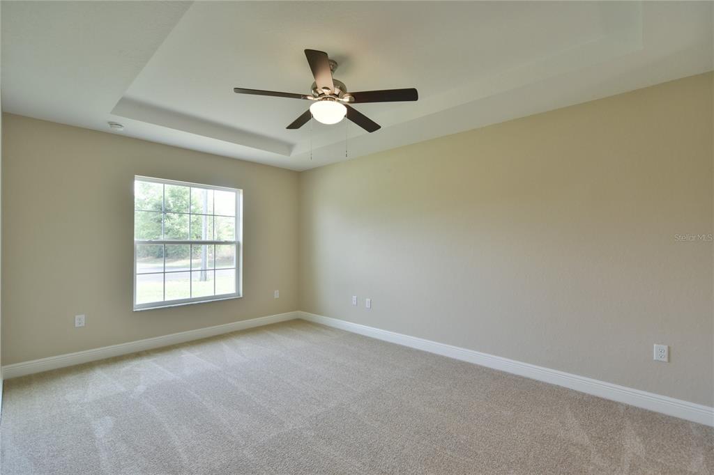 16219 Southwest 48th Circle Ocala, FL 34473 - Photo 26 of 36 an empty room with a window and a fan