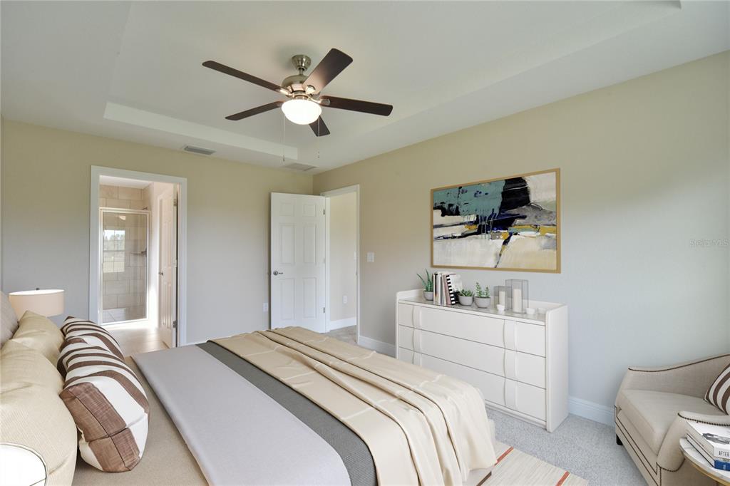 16219 Southwest 48th Circle Ocala, FL 34473 - Photo 27 of 36 a bedroom with a bed and ceiling fan