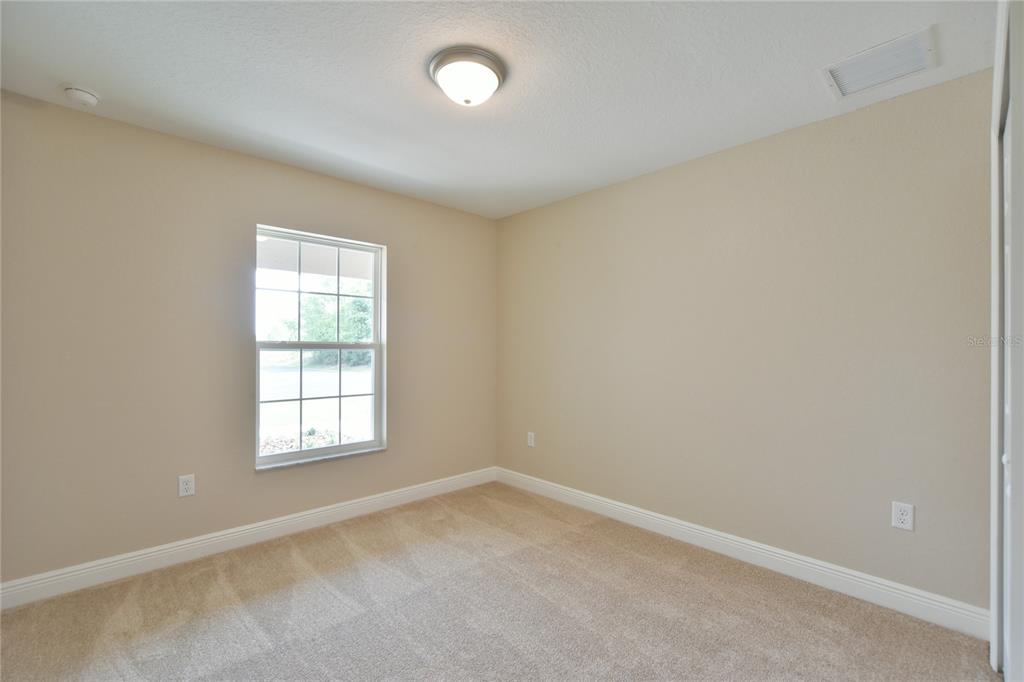16219 Southwest 48th Circle Ocala, FL 34473 - Photo 31 of 36 an empty room with a window