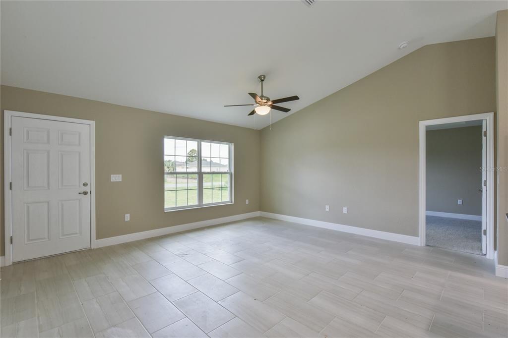 16219 Southwest 48th Circle Ocala, FL 34473 - Photo 5 of 36 a view of an empty room with a window