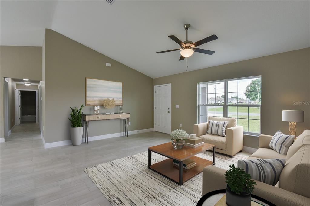16219 Southwest 48th Circle Ocala, FL 34473 - Photo 6 of 36 a living room with furniture and a large window
