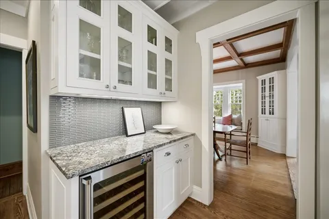 a open kitchen with a granite countertop sink and cabinets