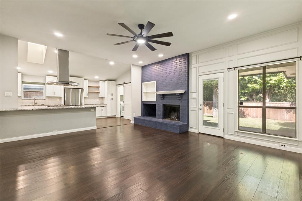 3010 Rambling Drive Dallas, TX 75228 - Photo 8 of 25 Open-concept living area featuring rich wood-finish flooring, a contemporary ceiling fan, and recessed lighting