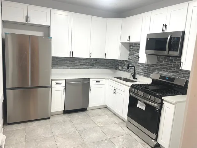 a kitchen with a stove microwave and refrigerator