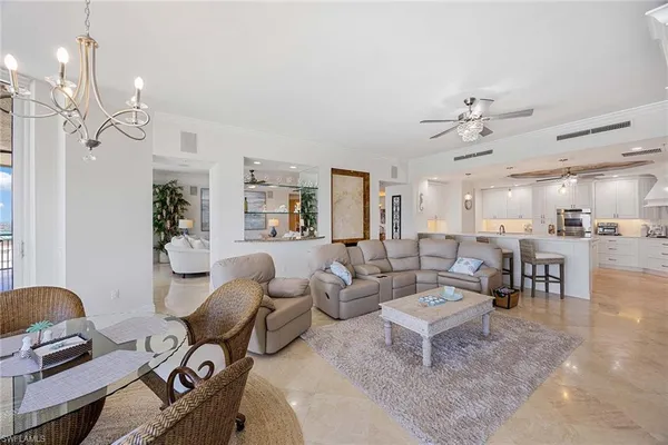 a large kitchen with a table and chairs
