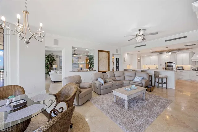 a large kitchen with a table and chairs