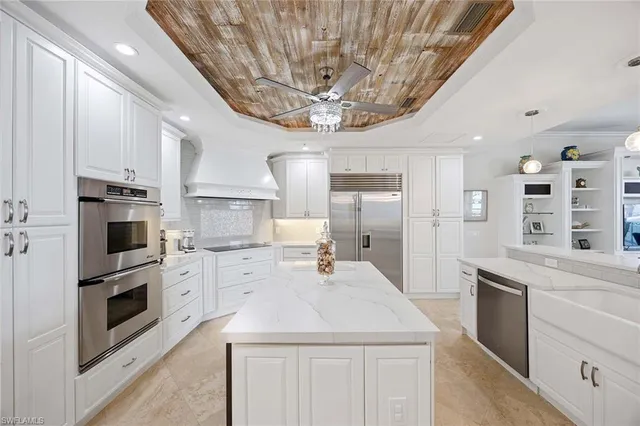a bedroom with a bed dresser and a flat tv screen