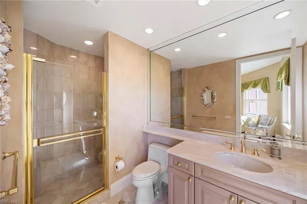 a bedroom with two beds and painting on the wall