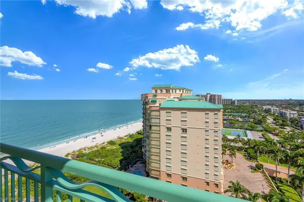 a view of a balcony with furniture