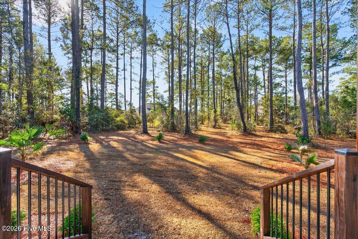 355 South Middleton Drive Northwest Calabash, NC 28467 - Photo 34 of 81 Spacious outdoor area ideal for entertaining, grilling, or enjoying golf course community living.