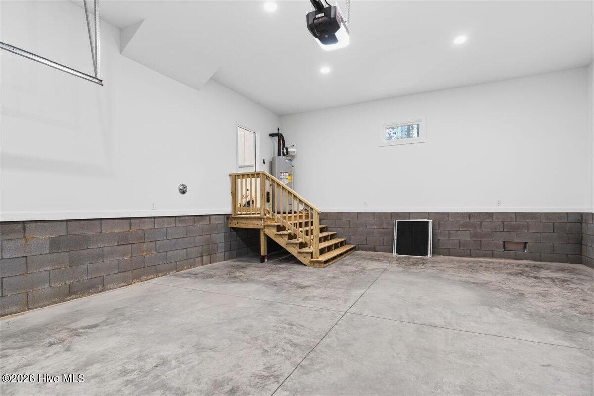 355 South Middleton Drive Northwest Calabash, NC 28467 - Photo 35 of 81 Attached 2-car garage with front entry and driveway parking—ideal for beach gear, golf carts, and storage.