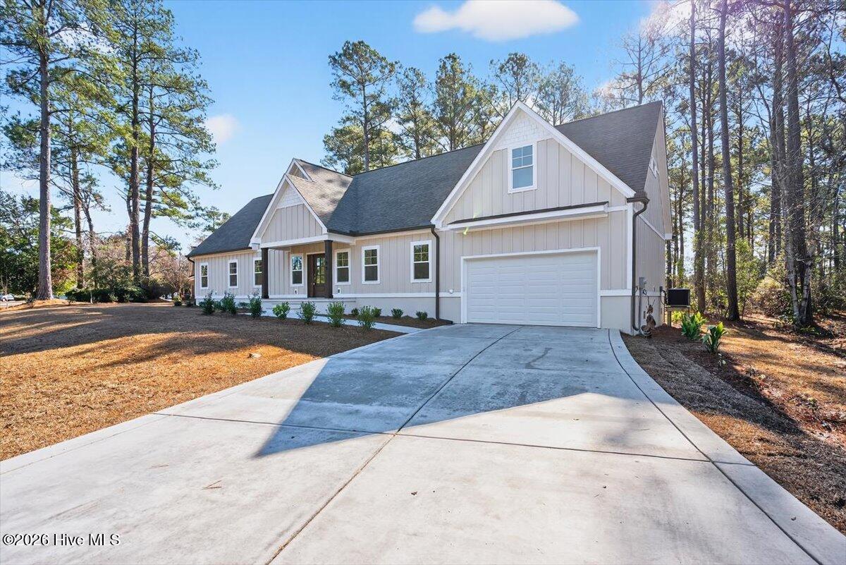355 South Middleton Drive Northwest Calabash, NC 28467 - Photo 37 of 81 Beautiful coastal-inspired exterior with architectural shingles and modern farmhouse style in a premier gated neighborhood.