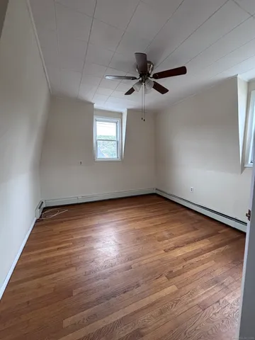 an empty room with a empty space and windows