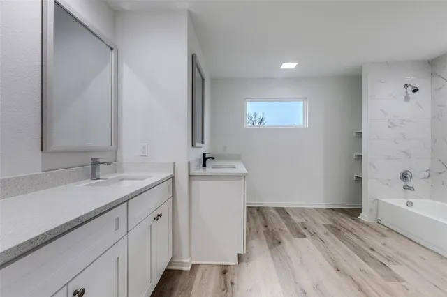 a bathroom with a sink and a bathtub