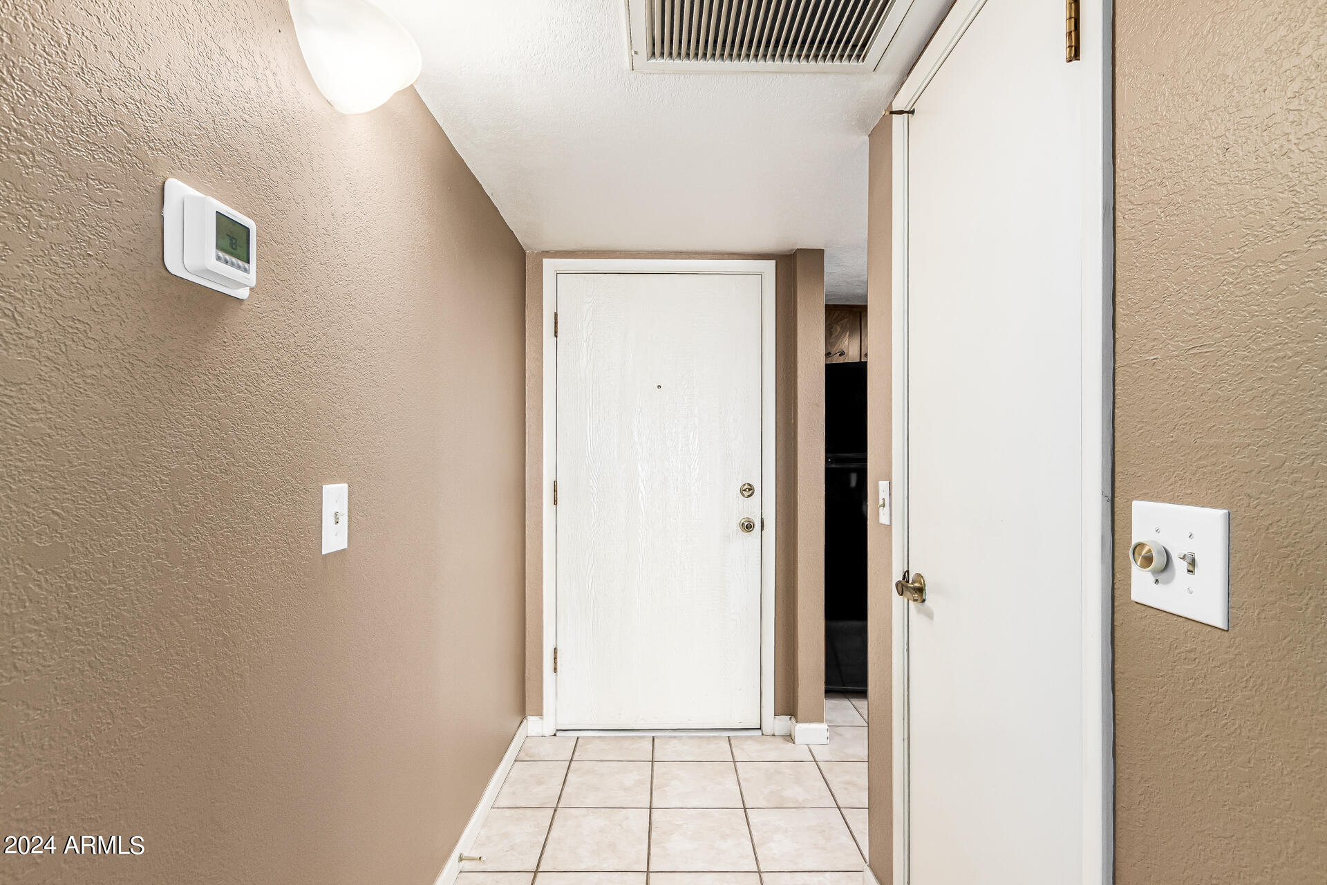 4150 East Cactus Road, Unit 118 Phoenix, AZ 85032 - Photo 4 of 19 Front Foyer with Storage