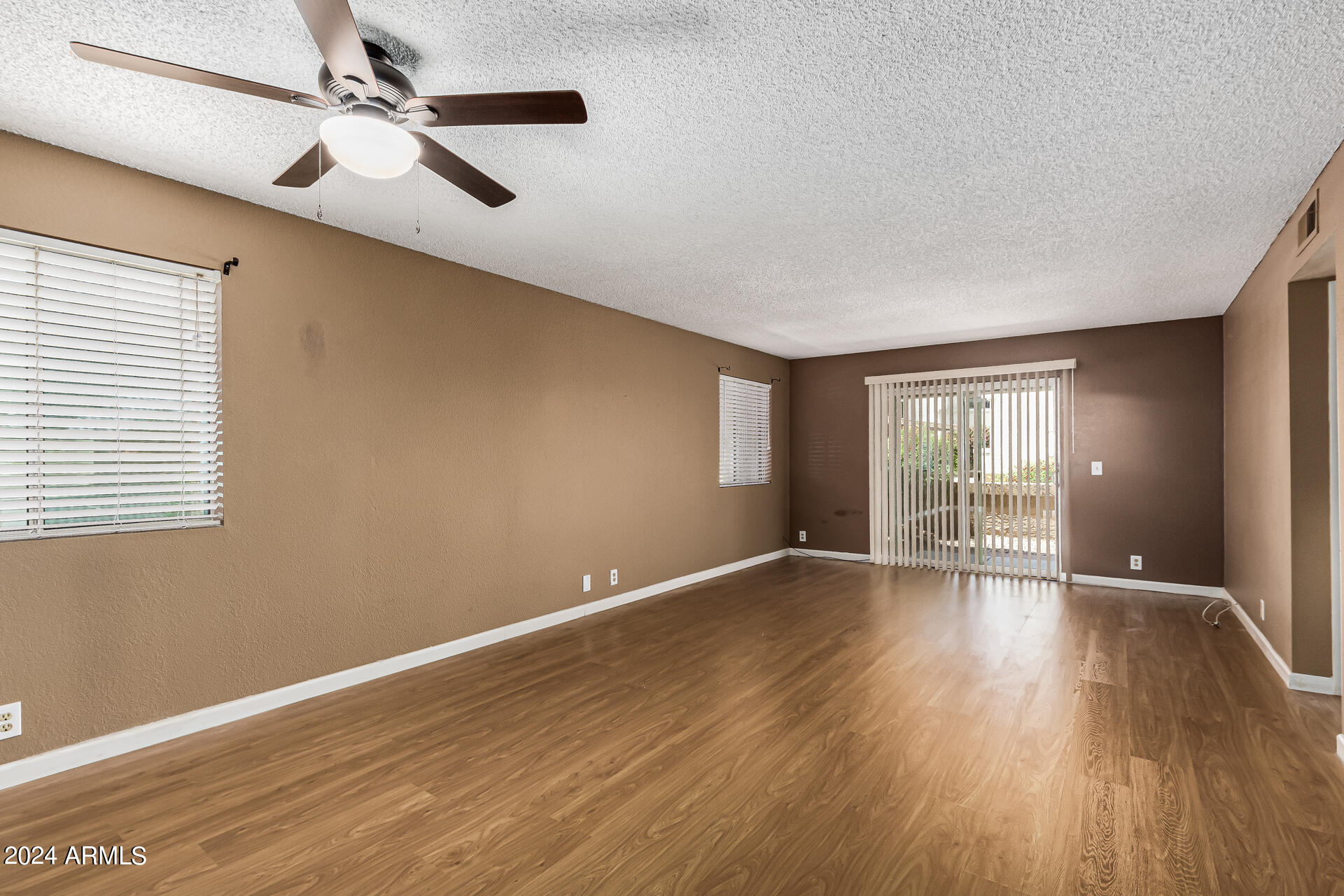 4150 East Cactus Road, Unit 118 Phoenix, AZ 85032 - Photo 7 of 19 Large Great Room Towards Rear Patio