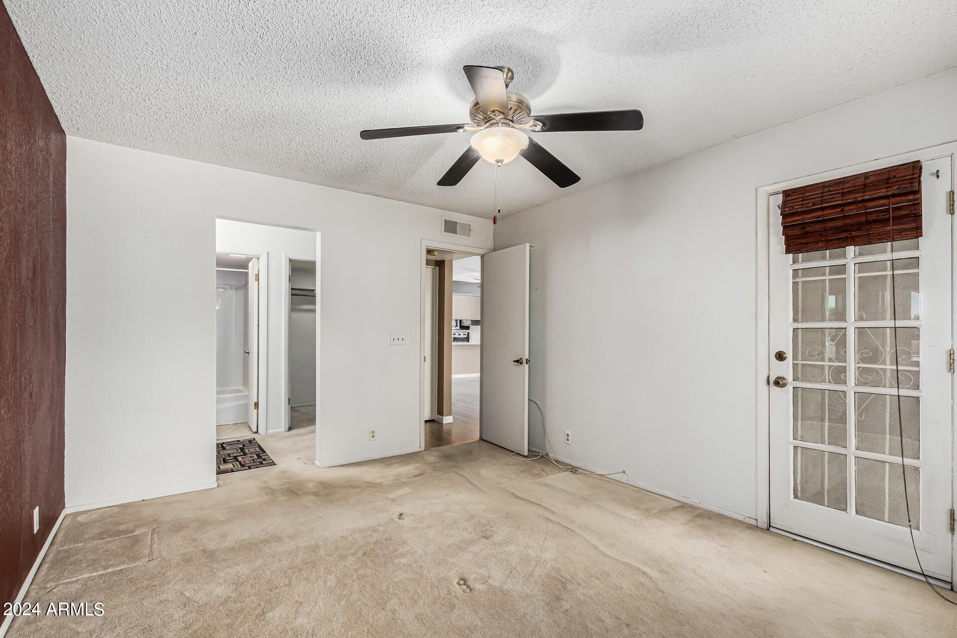 4150 East Cactus Road, Unit 118 Phoenix, AZ 85032 - Photo 10 of 19 Primary Bedroom with Fan (2)