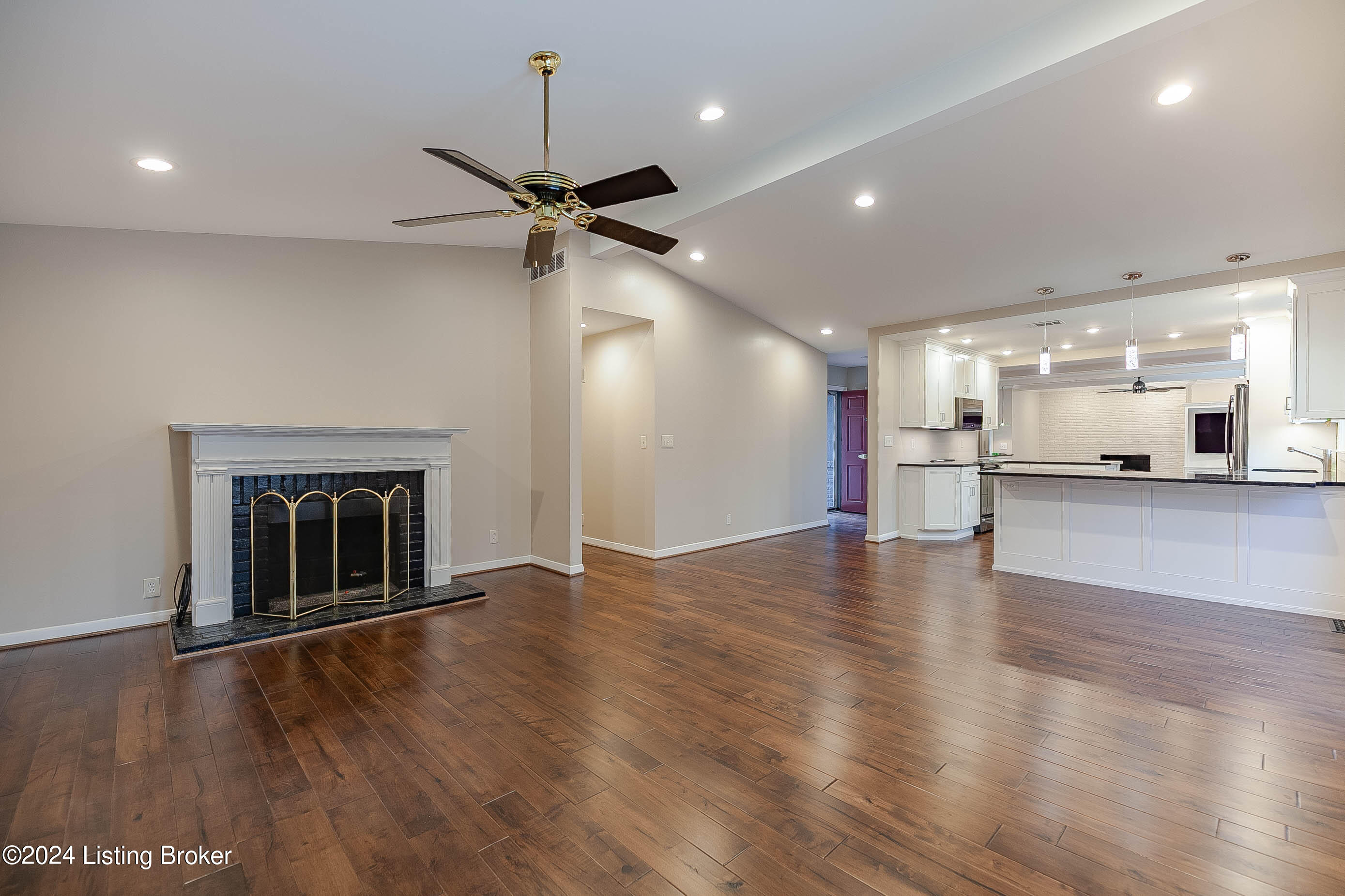 Great room/living room with vaulted ceiling