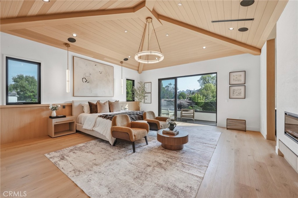16252 Addison Street Encino, CA 91436 - Photo 11 of 36 a living room with patio furniture and a large window
