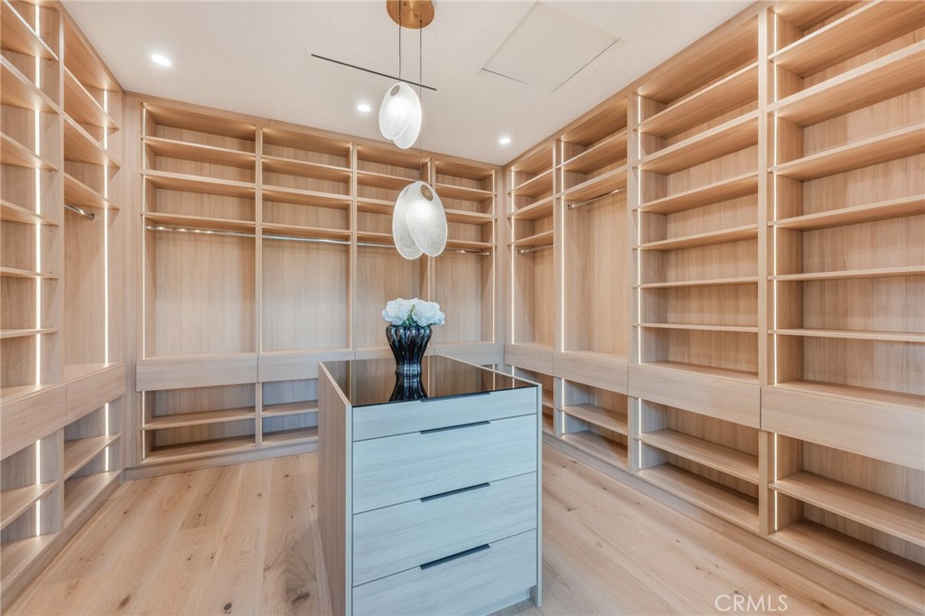 16252 Addison Street Encino, CA 91436 - Photo 13 of 36 a view of walk in closet with empty racks