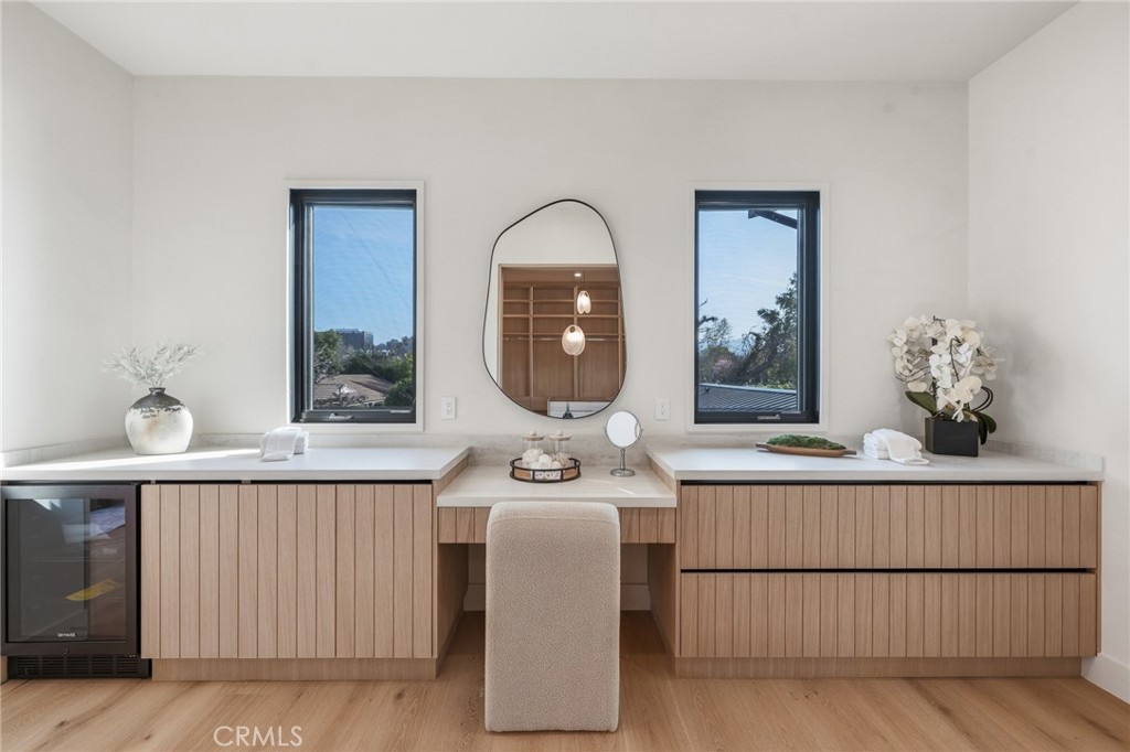 16252 Addison Street Encino, CA 91436 - Photo 14 of 36 a room with a table chairs and a wooden floor