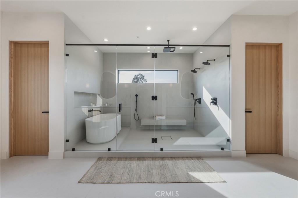 16252 Addison Street Encino, CA 91436 - Photo 17 of 36 a bathroom with a bathtub and a shower