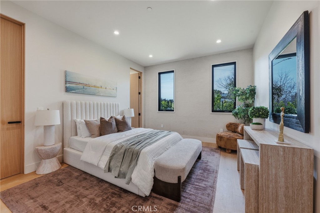 16252 Addison Street Encino, CA 91436 - Photo 18 of 36 a bedroom with a large bed and windows