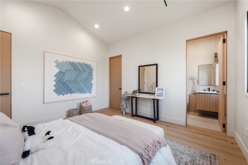 16252 Addison Street Encino, CA 91436 - Photo 20 of 36 a bedroom with a bed and a desk