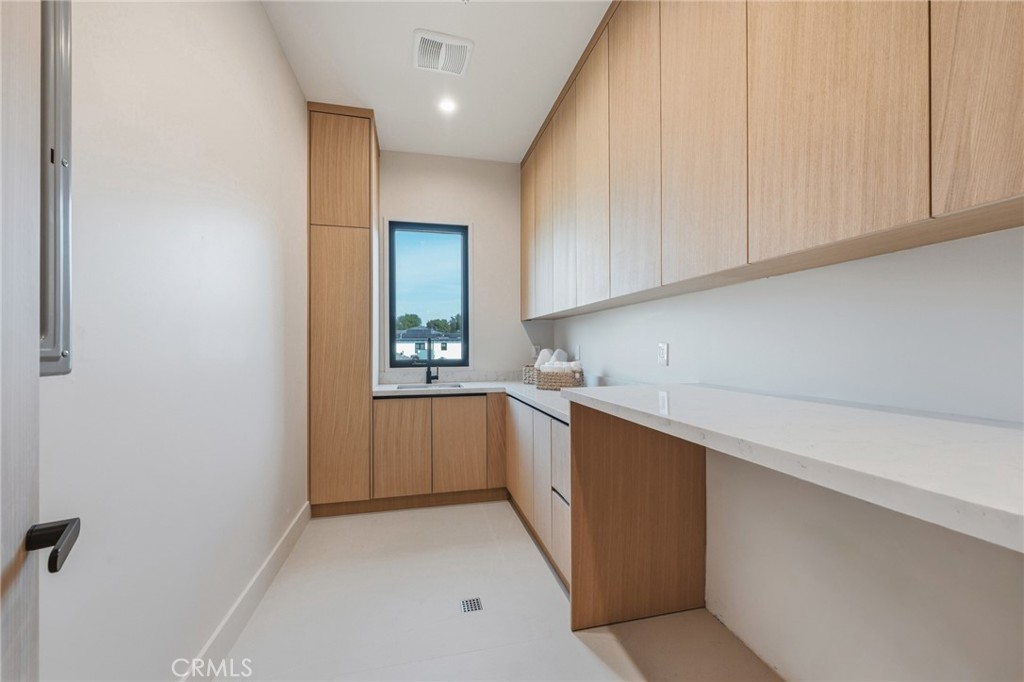 16252 Addison Street Encino, CA 91436 - Photo 26 of 36 a view of cabinets with wooden floor