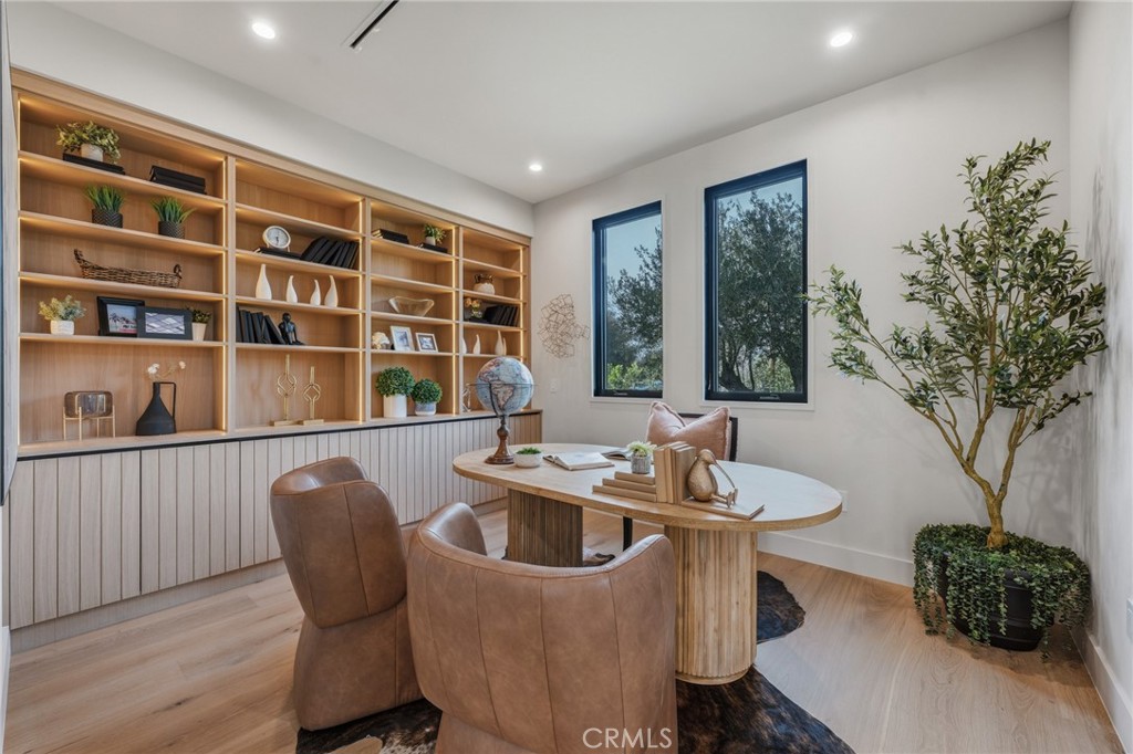 16252 Addison Street Encino, CA 91436 - Photo 4 of 36 a dining room with furniture and a potted plant