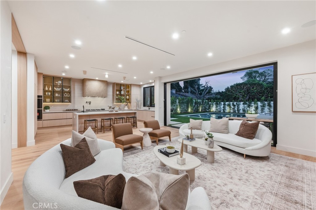 16252 Addison Street Encino, CA 91436 - Photo 6 of 36 a living room with furniture and a large window
