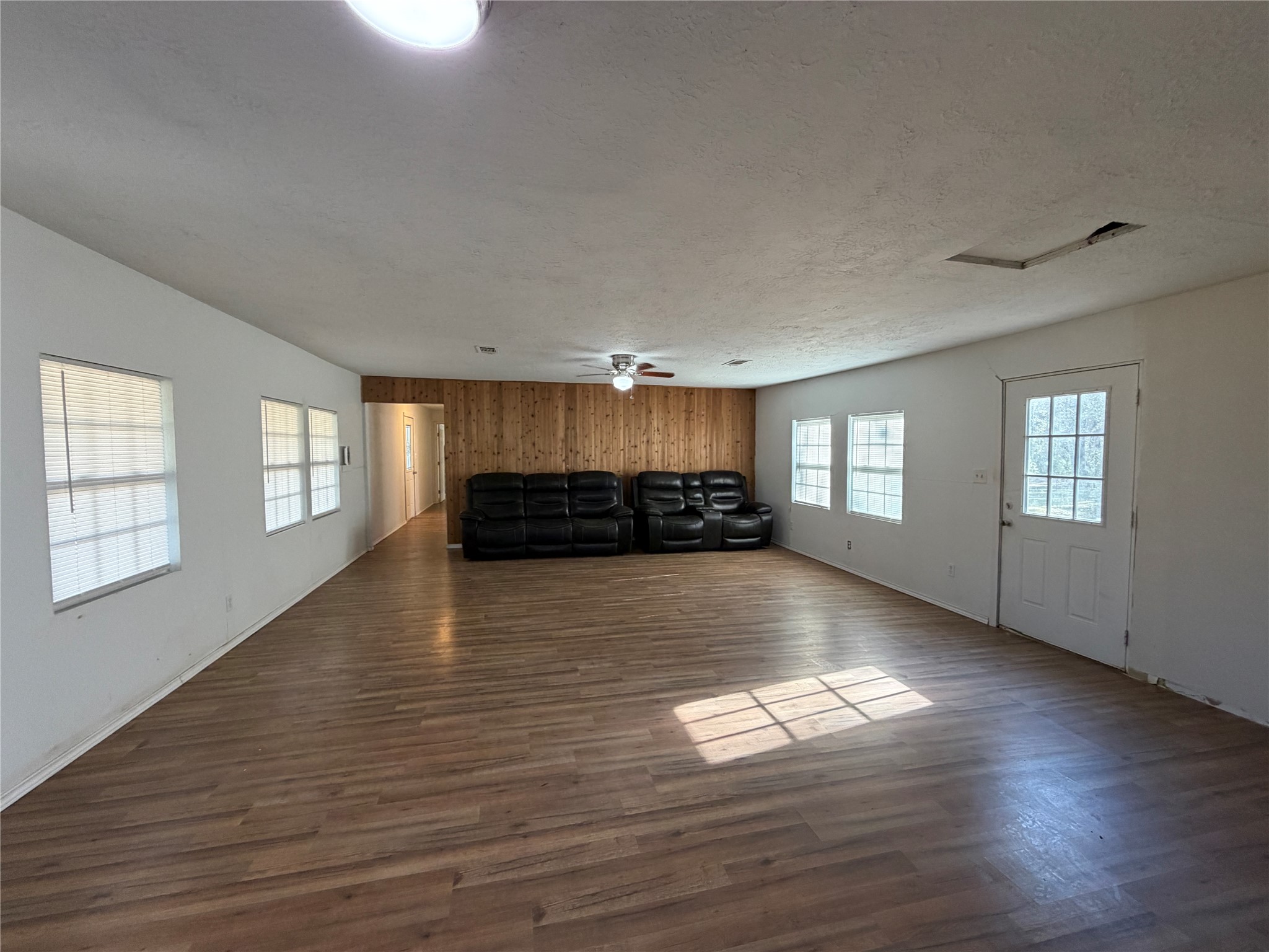 397 County Road 2117 Cleveland, TX 77327 - Photo 12 of 46 a view of empty room with wooden floor and fan