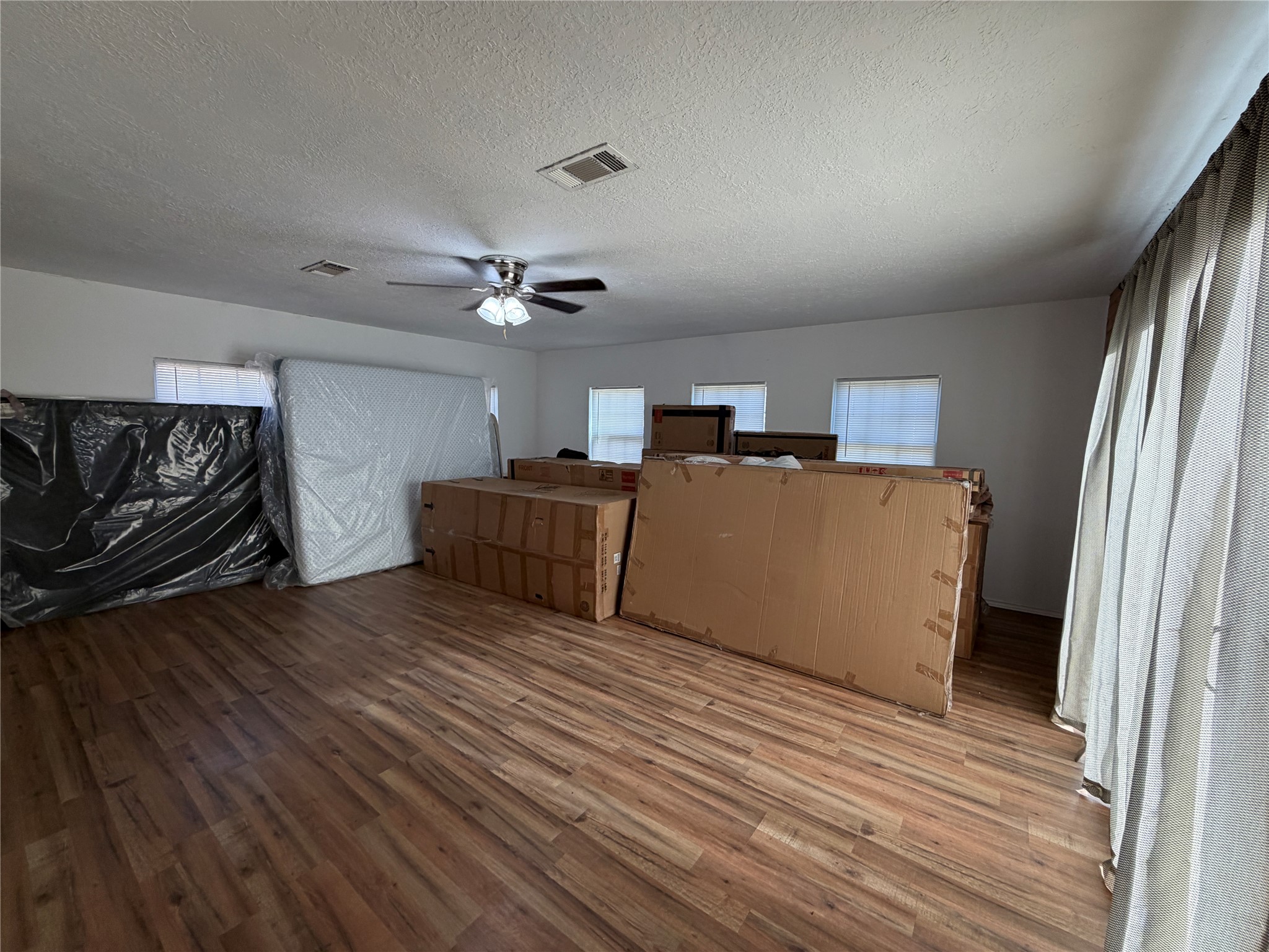 397 County Road 2117 Cleveland, TX 77327 - Photo 22 of 46 a view of a kitchen with furniture and wooden floor