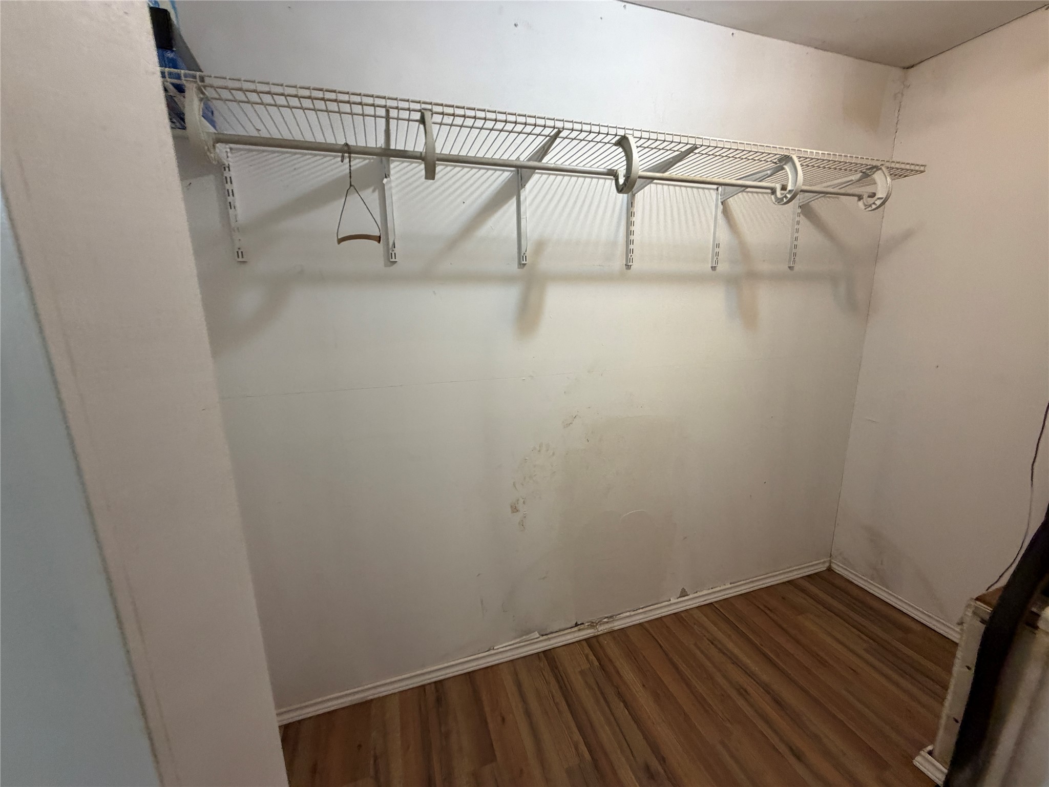 397 County Road 2117 Cleveland, TX 77327 - Photo 27 of 46 a view of a room with racks on the wall