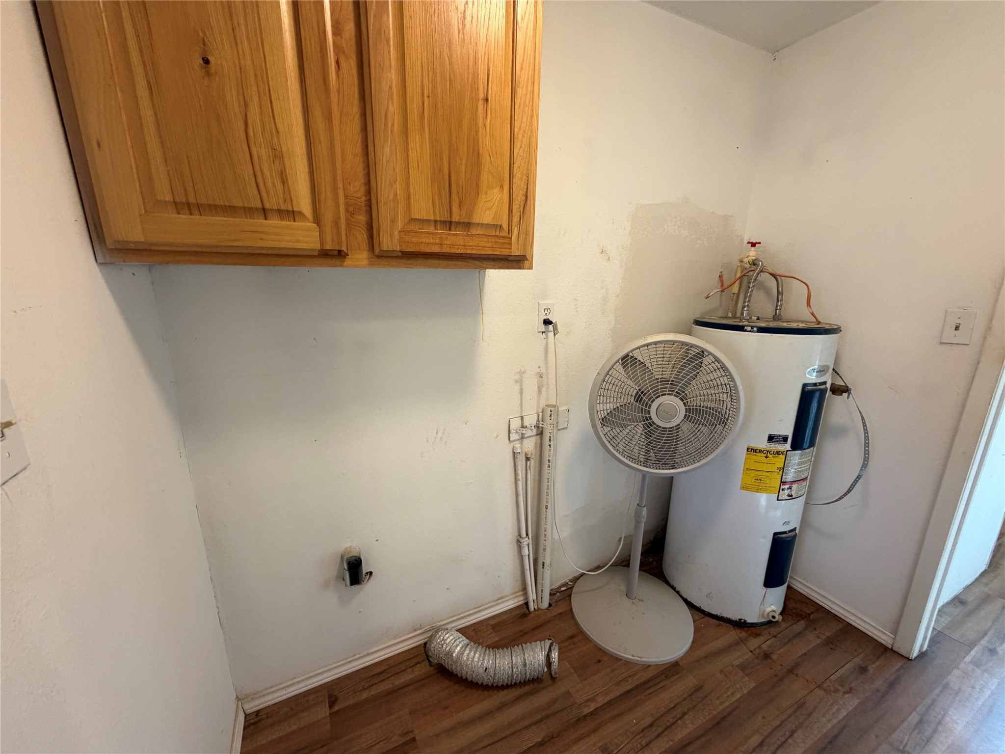 397 County Road 2117 Cleveland, TX 77327 - Photo 30 of 46 a view of dining room with wooden floor