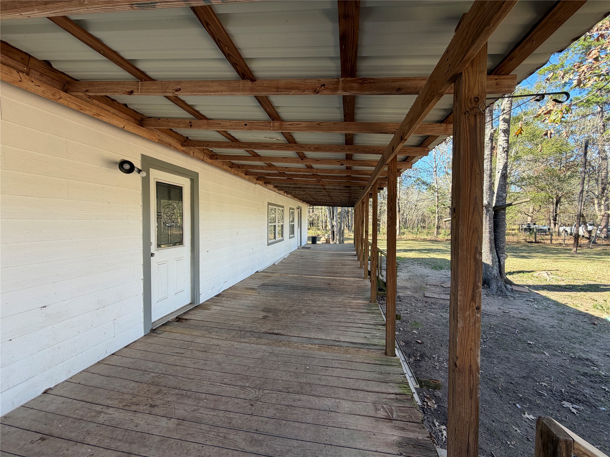 397 County Road 2117 Cleveland, TX 77327 - Photo 3 of 46 a view of a porch