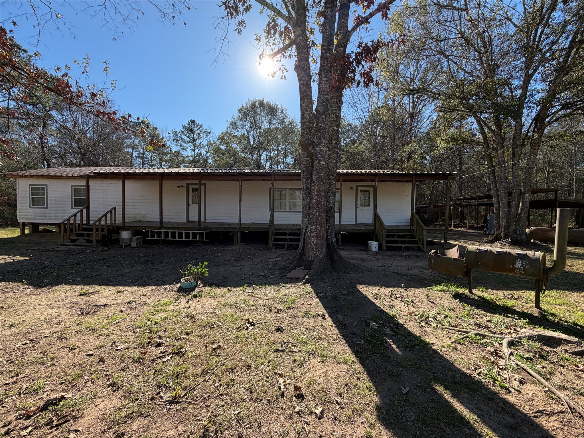 397 County Road 2117 Cleveland, TX 77327 - Photo 31 of 46 a view of a backyard with sitting area