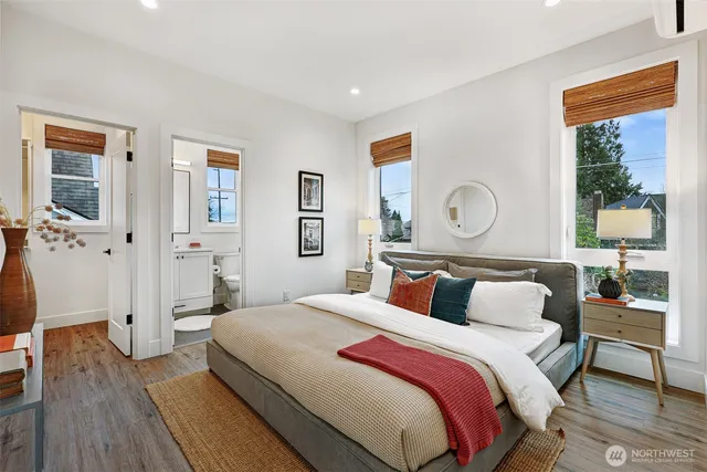 a bedroom with a large bed and a window