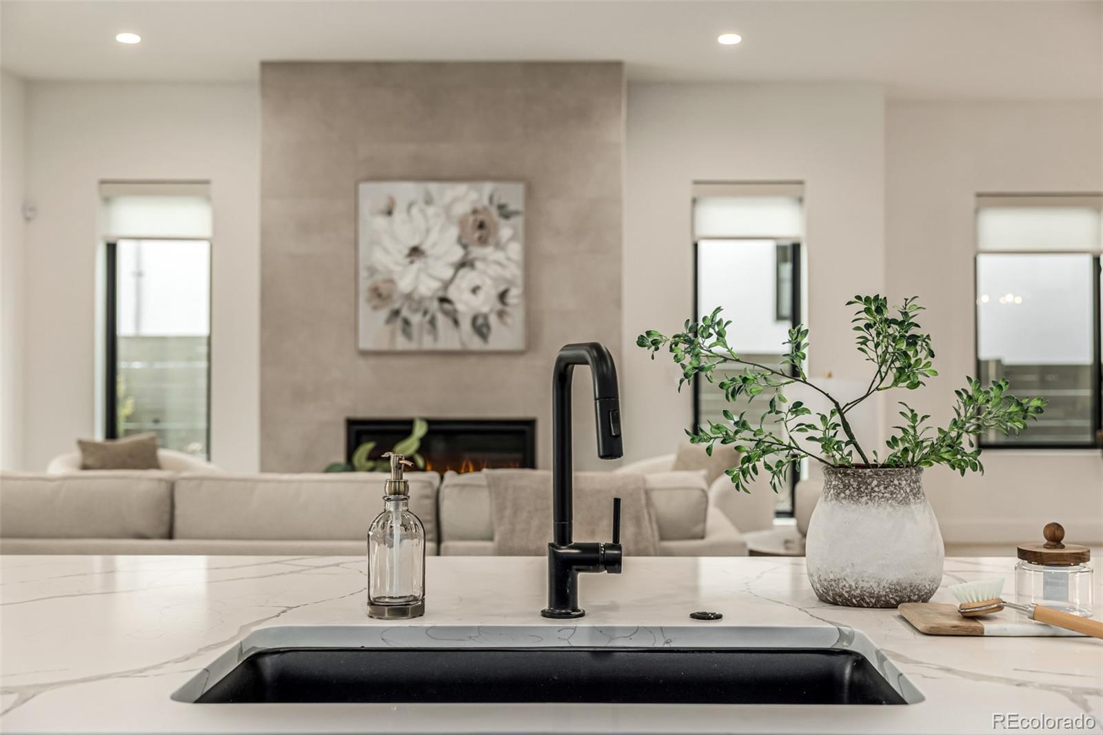 5904 West 37th Place Wheat Ridge, CO 80212 - Photo 12 of 50 a dining room with wooden floor and a potted plant
