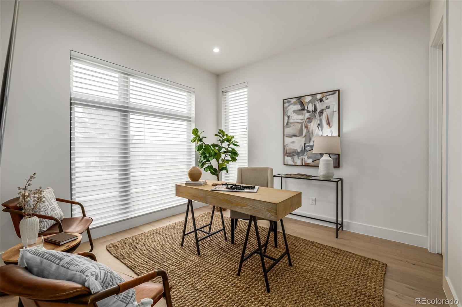 5904 West 37th Place Wheat Ridge, CO 80212 - Photo 18 of 50 a living room with furniture and a potted plant
