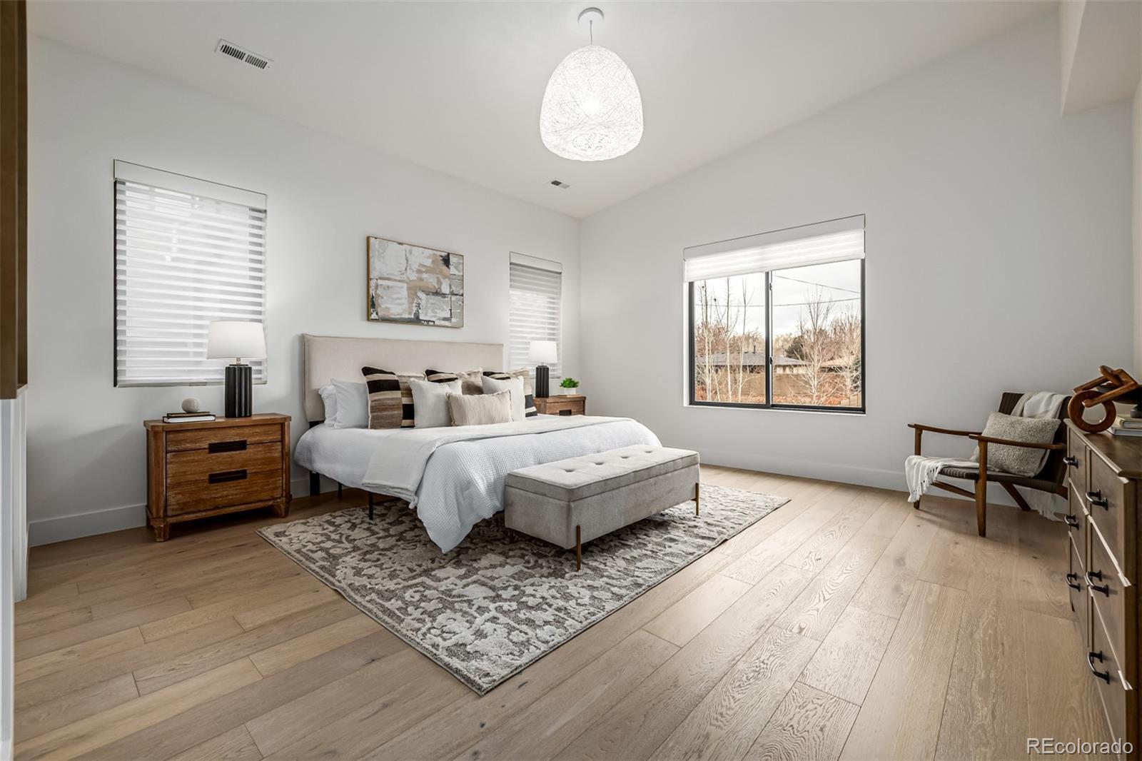 5904 West 37th Place Wheat Ridge, CO 80212 - Photo 20 of 50 a bedroom with a bed couch and a window