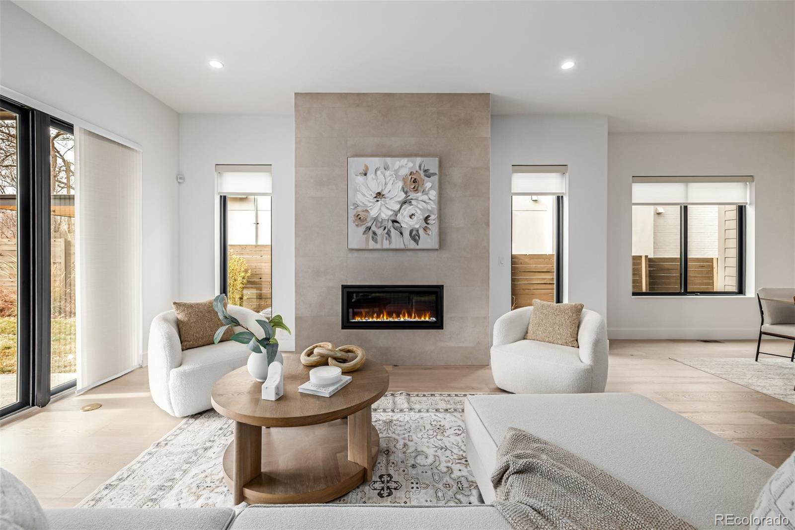 5904 West 37th Place Wheat Ridge, CO 80212 - Photo 3 of 50 a living room with furniture and a fireplace