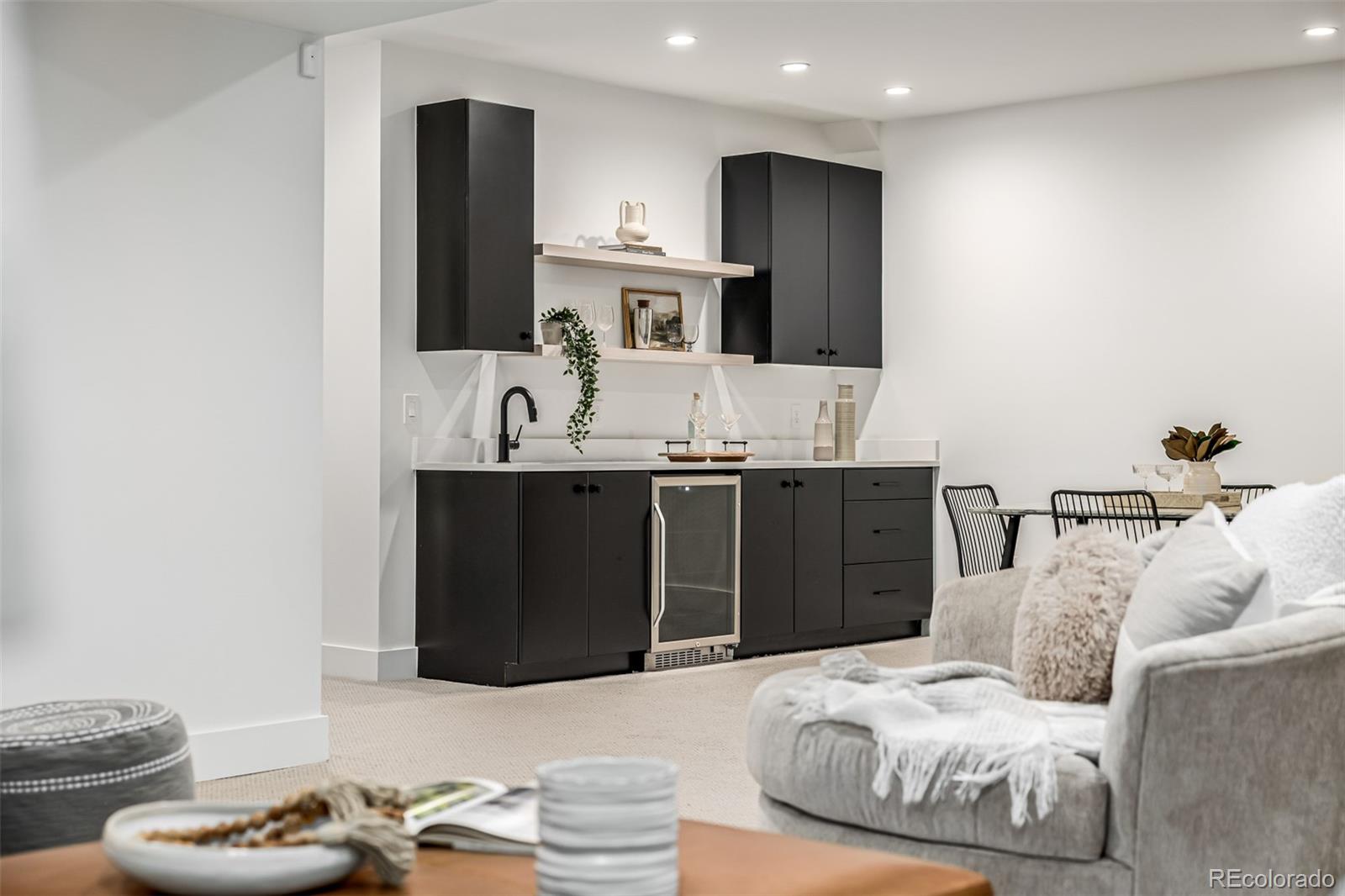 5904 West 37th Place Wheat Ridge, CO 80212 - Photo 38 of 50 a bedroom with a bed and a mirror