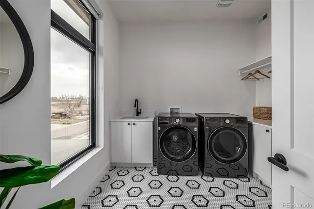 a kitchen with stainless steel appliances kitchen island granite countertop a large counter top space and wooden floor