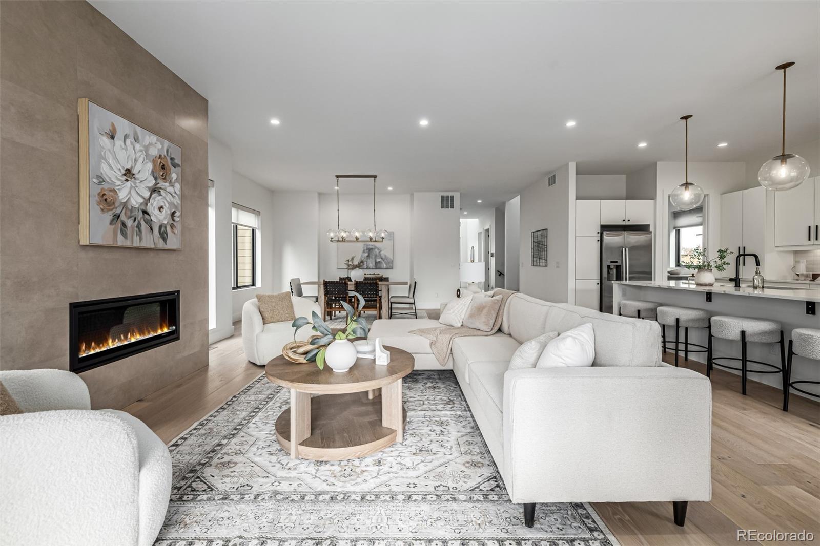 5904 West 37th Place Wheat Ridge, CO 80212 - Photo 5 of 50 a living room with furniture and a fireplace