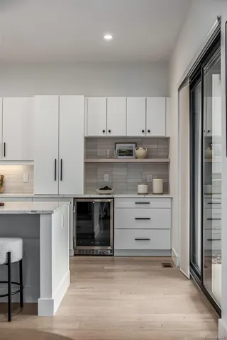 a kitchen with stainless steel appliances granite countertop a stove and a refrigerator